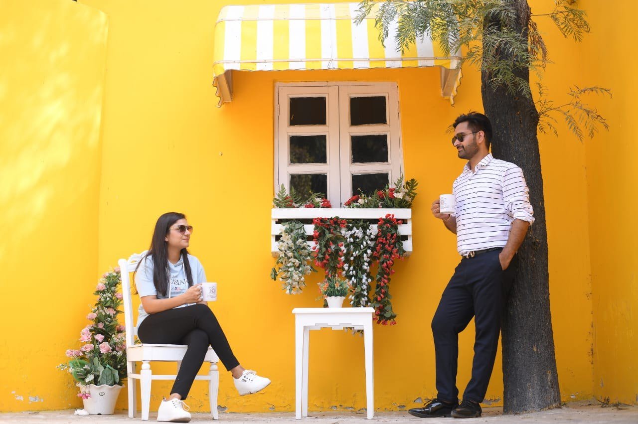 Couple enjoying a relaxed outdoor celebration-style portrait